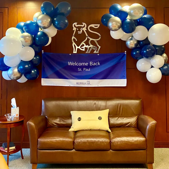 two basic balloon garlands over brown leather sofa