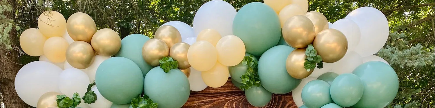 balloons in green white and gold